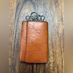 Gucci Guccissima leather wallet in orange.